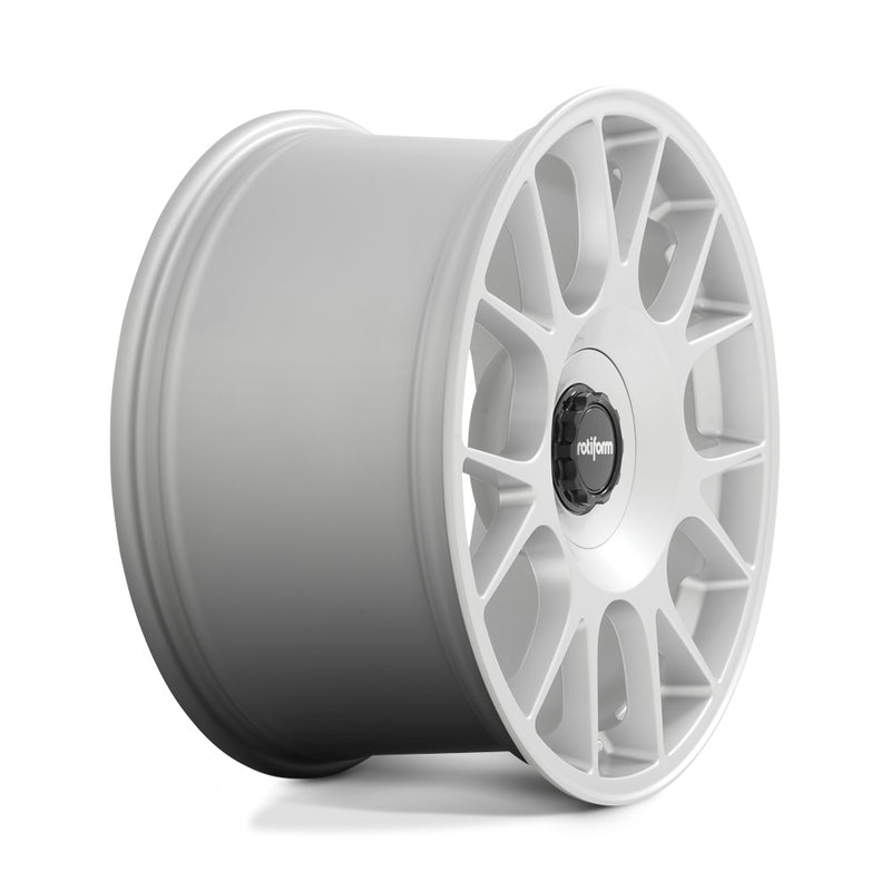 Side view of a Rotiform TUF-R monoblock cast aluminum 7 spoke design automotive wheel in satin silver finish with a black center cap with a silver Rotiform logo.