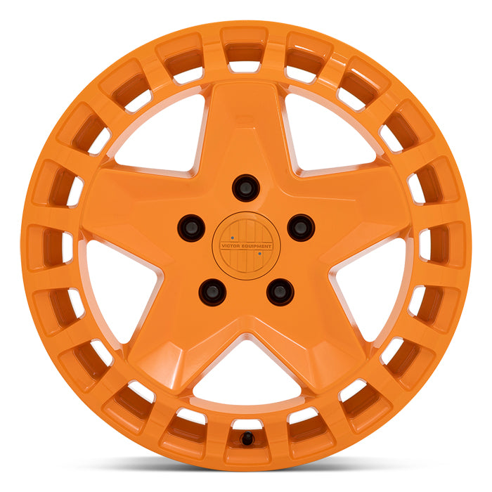 Front Face View Of An 18" Victor Equipment Alpen Cast Aluminum 5 Spoke Concave Wheel In A Gloss Orange Finish With A Square Hole Design To The Outer Edge