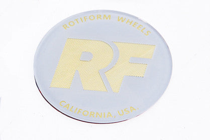 Rotiform's white and gold RF center cap insert for threaded hex nut.