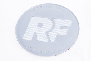 Rotiform's white and silver RF center cap insert for threaded hex nut.