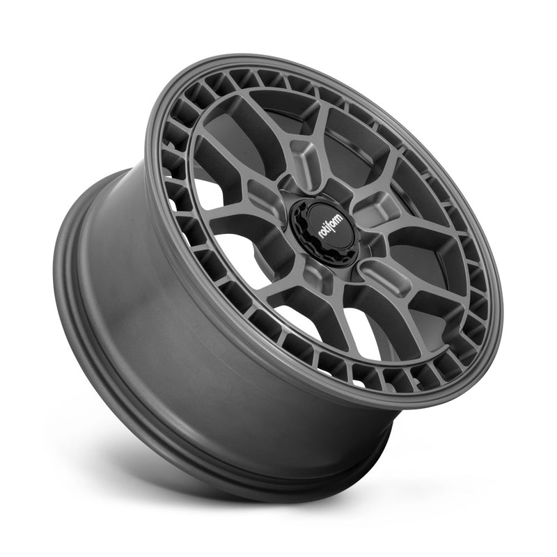 Tilted side view of a Rotiform ZMO-M monoblock cast aluminum 5 Y shape spoke automotive wheel in a matte anthracite finish with a square hole pattern to the outer edge and a black center cap with a silver Rotiform logo.