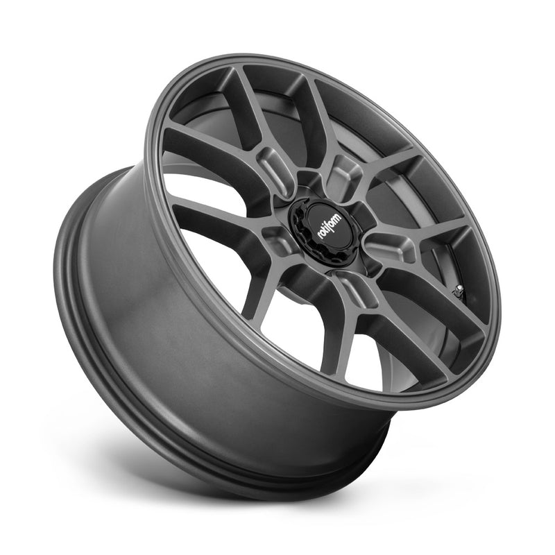 Tilted side view of a Rotiform ZMO monoblock cast aluminum 5 Y shape spoke automotive wheel in a matte anthracite finish with a black center cap having a silver Rotiform logo.